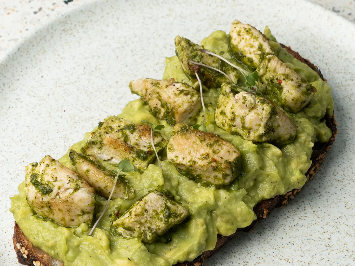 Avocado toast topped with seasoned avocado cubes at Smash Avocaderia restaurant, El Poblado