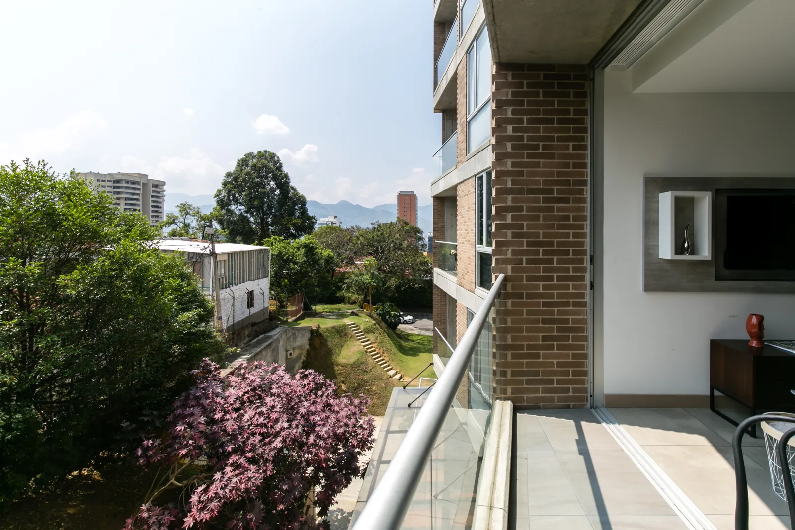 Private balcony with garden and city views from the apartment for sale at Soul Lifestyle