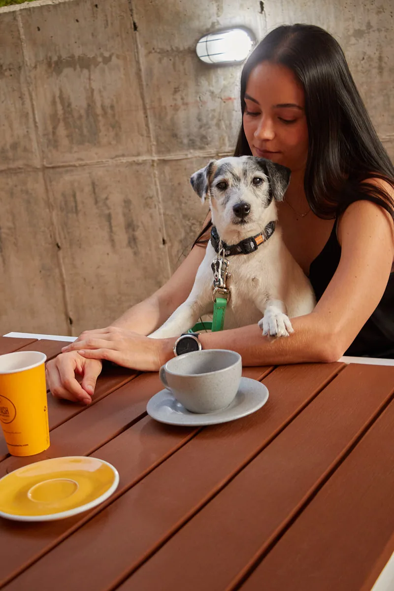 Guest enjoying coffee with her dog at Soul Lifestyle Apartments, El Poblado