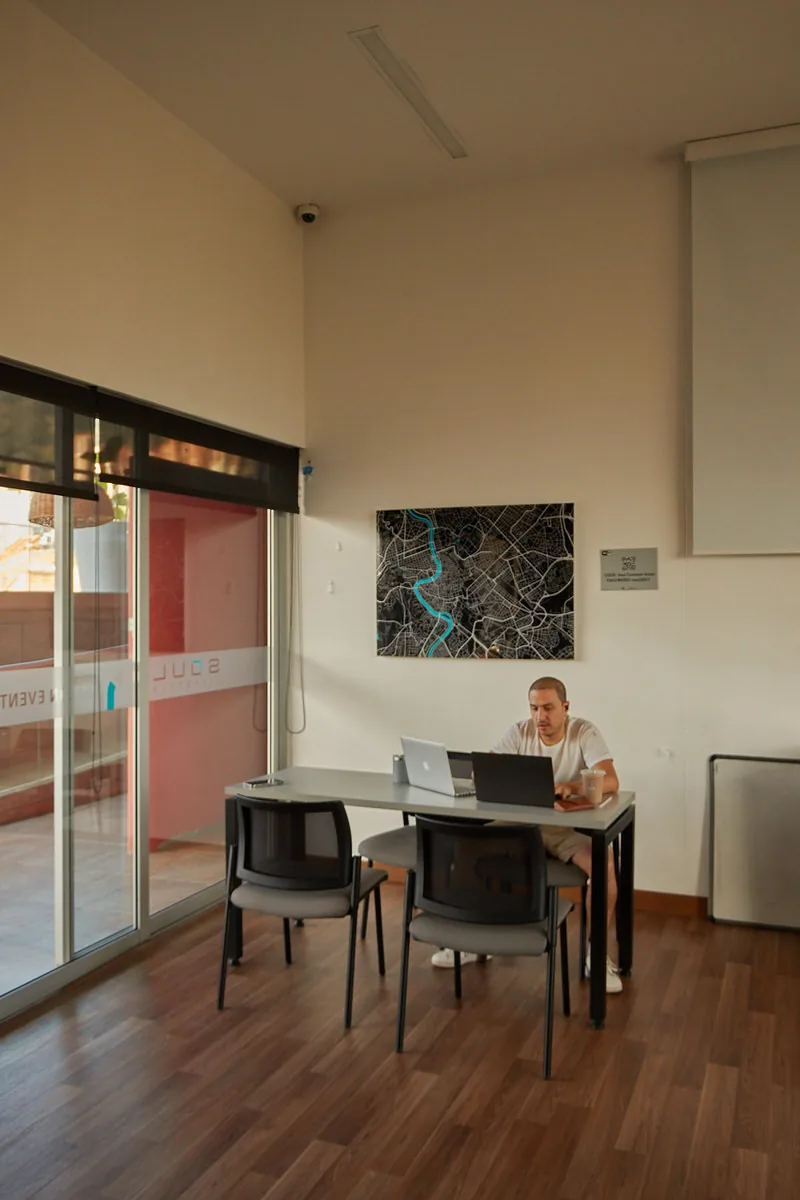 Guest working in the coworking space at Soul Lifestyle Apartments, Medellín
