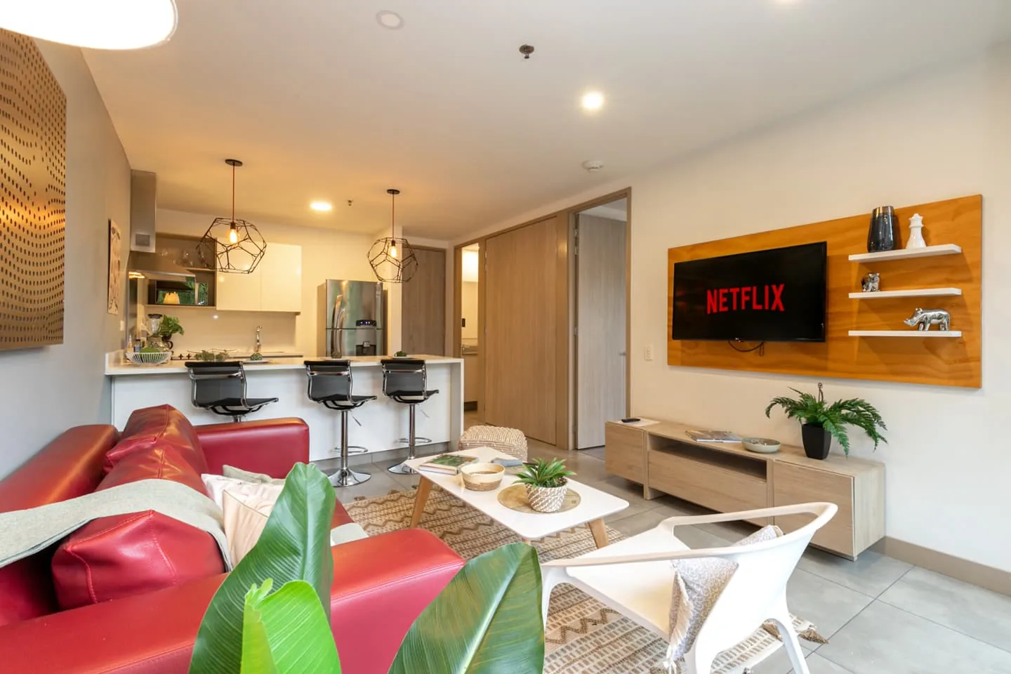 Living room with TV in the apartment for sale at Soul Lifestyle Apartments