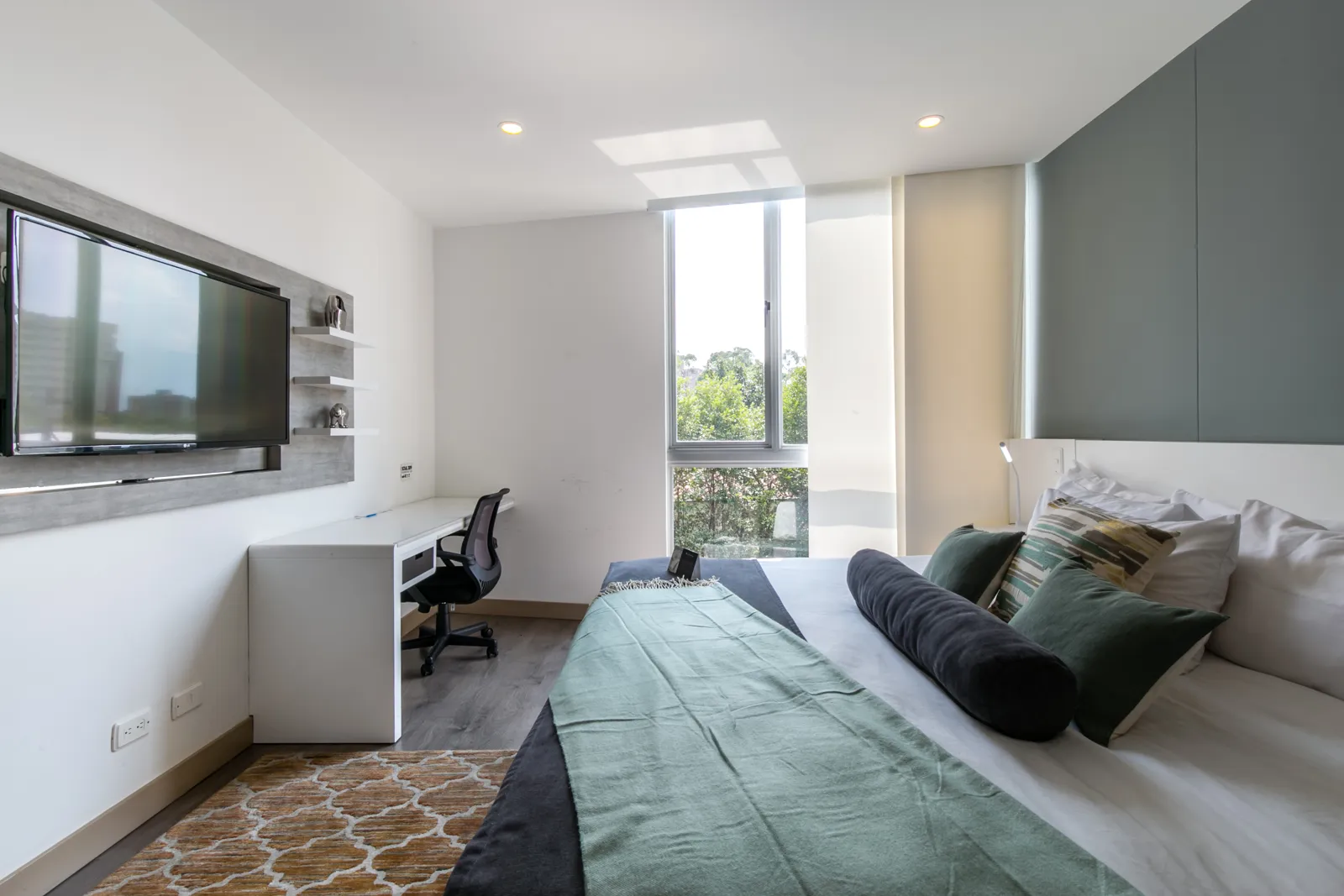 Bedroom with work desk and TV in the apartment for sale at Soul Lifestyle Apartments