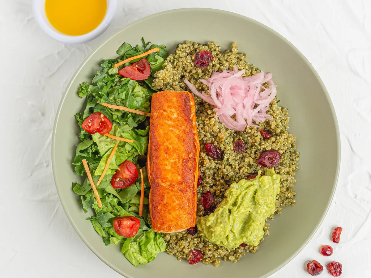 Salmon bowl with quinoa, leafy greens and avocado smash at Smash Avocaderia, Soul Lifestyle Apartments