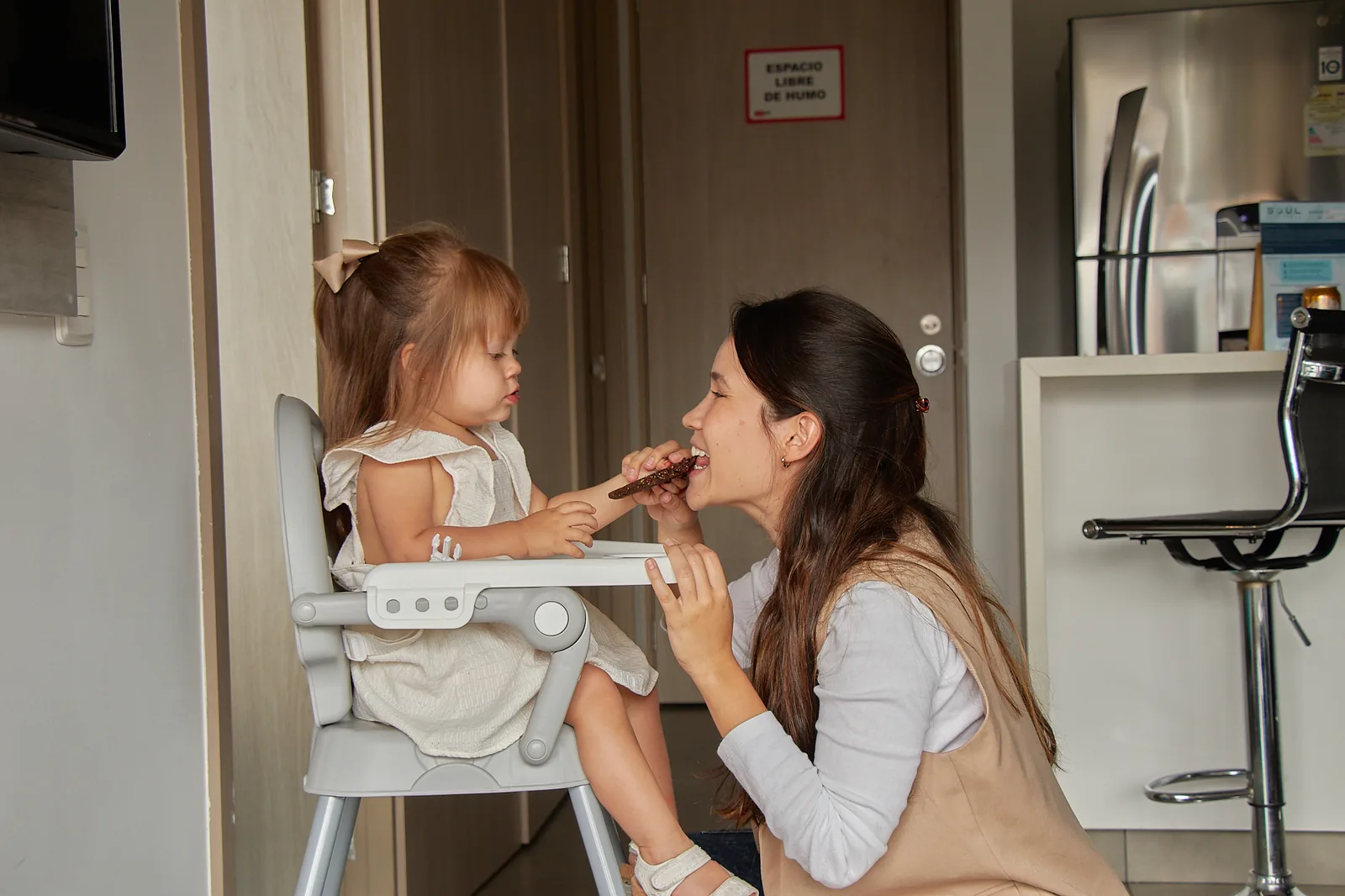 Toddler in a high chair at Soul Lifestyle Apartments, Medellín