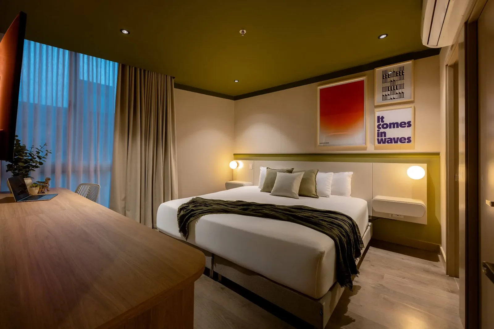 Bedroom at dusk in a Premium apartment at Soul Lifestyle Apartments, Medellín
