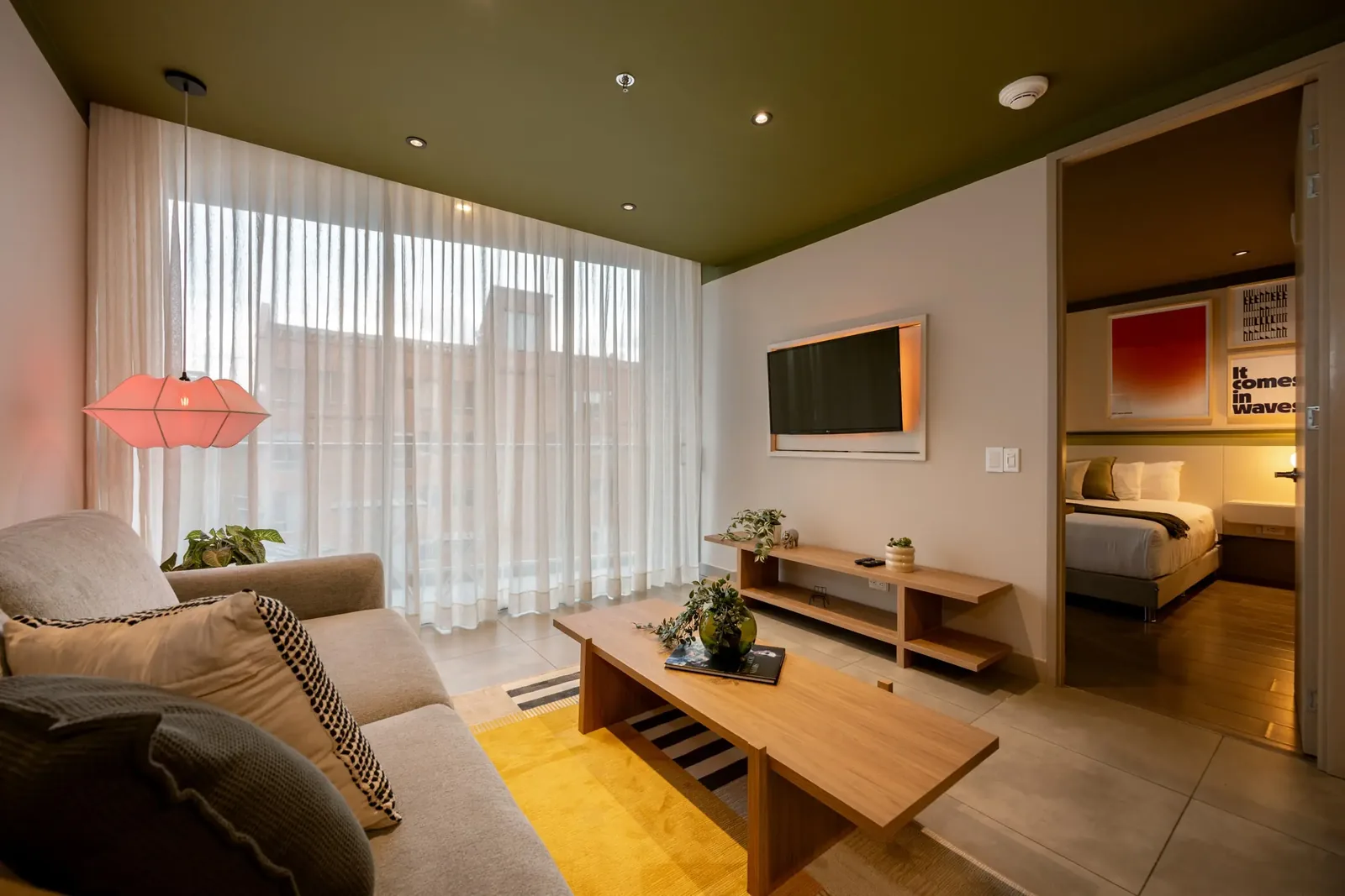 Living room with TV in a Premium apartment at Soul Lifestyle Apartments