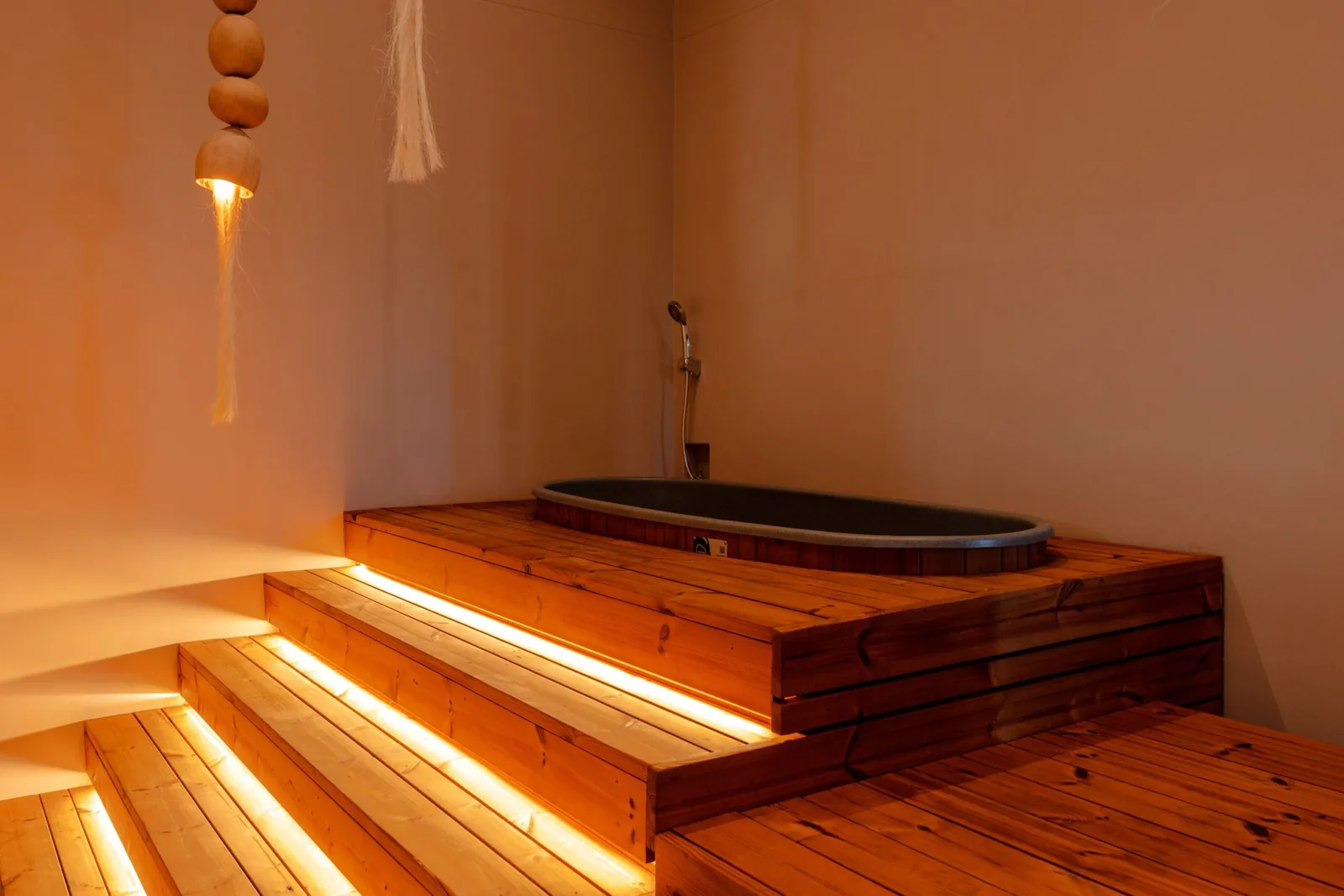 Steps into the cold plunge in the wellness zone at Soul Lifestyle Apartments
