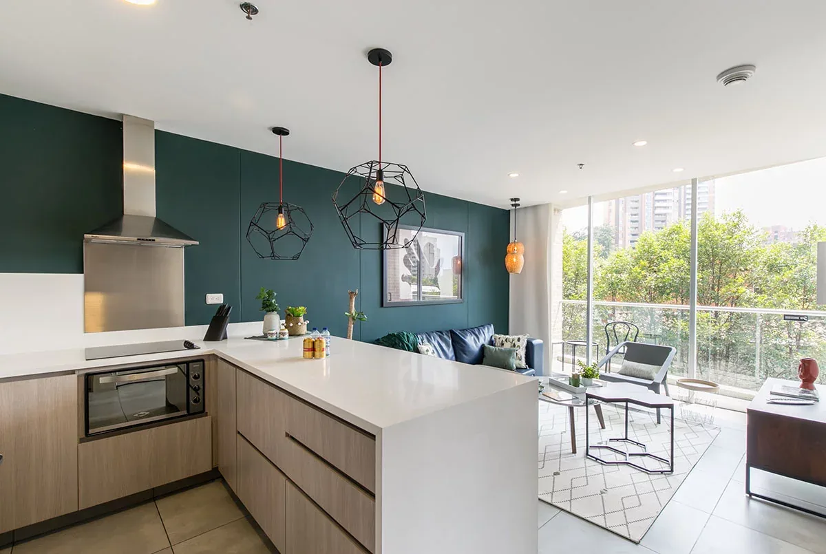 Kitchen with green accent wall in a Classic apartment at Soul Lifestyle, El Poblado